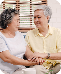 Asian elderly couple holding hands